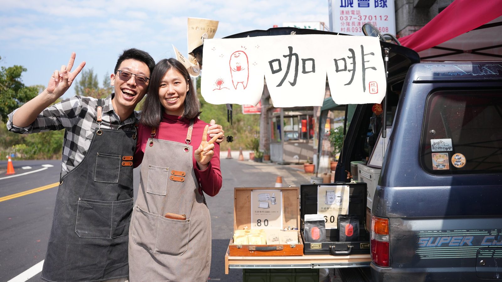 Awei and his wife in front of the Wide Living Cup coffee truck